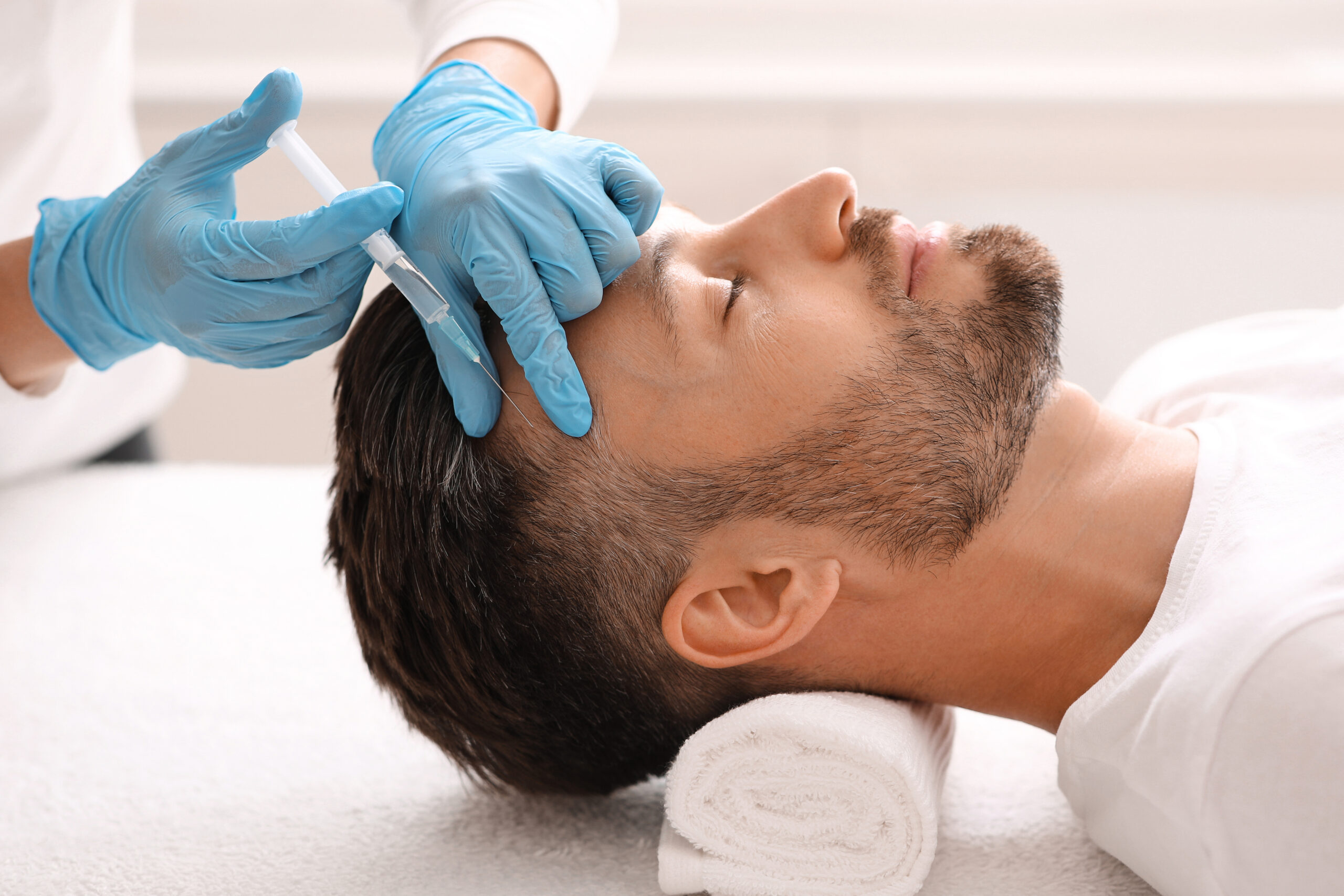 man getting prp for hair loss